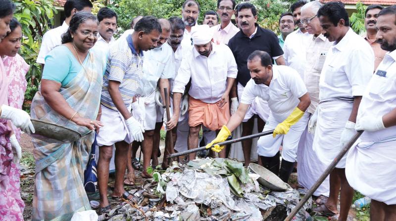 DCC president T.N. Prathapan and Anil Akkara, MLA, during a cleaning programme organised by Thrissur DCC on the premises of Government Medical College on Friday