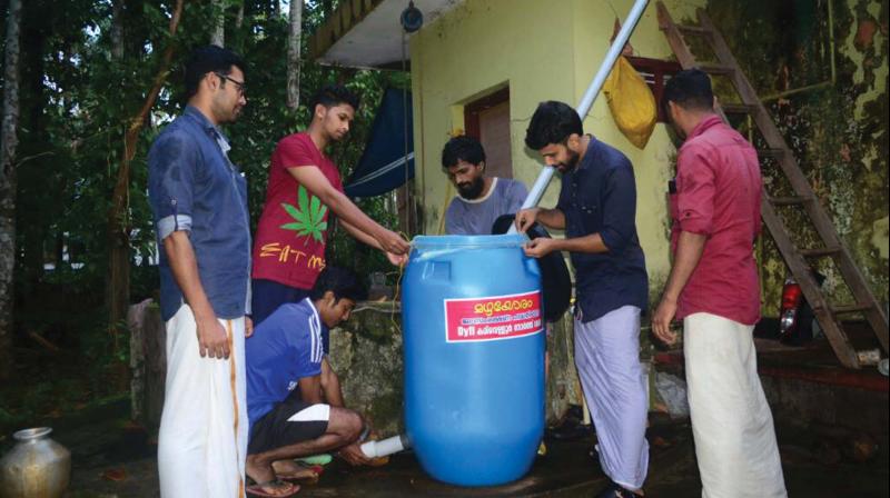 DYFI workers constructing a well recharge system.