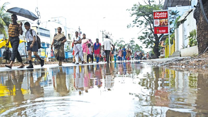 Heavy rains lashed parts of the city following a trough of low pressure over the Bay of Bengal on Tuesday. (Photo: DC)