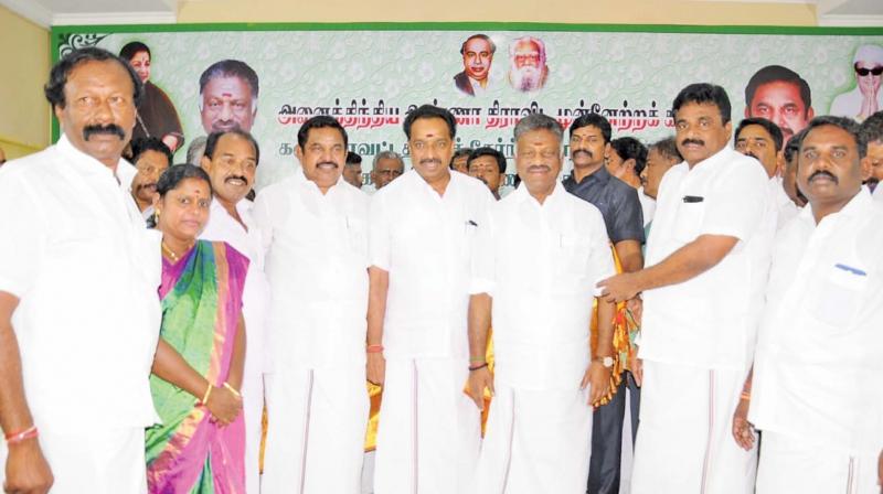 Supporters of various parties in Karur district join AIADMK in the presence of CM Edappadi K. Palaniswami and his deputy O. Panneerselvam at Royapettah on Thursday. (Photo: DC)