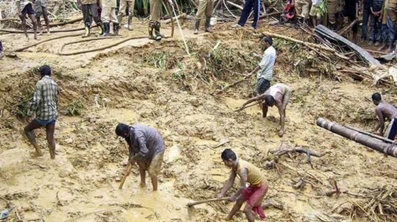 Bangladeshi fire fighters and residents search for bodies after a landslide in Bandarban Bangladeshi fire fighters and residents search for bodies after a landslide in Bandarban (Photo: ANI)