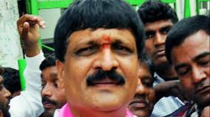 Mynampally became angry with Dolly Ramesh as he had left the TRS and joined the Congress. He pushed Ramesh from the stage and beat him up