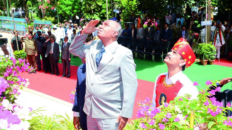 Acting Chief Justice Ramesh Ranganathan salutes the Tricolour after unfurling it, in the Hyderabad High Court premises on Tuesday.