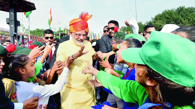 Narendra Modi interacts with children after addressing the nation from the ramparts of the Red Fort in New Delhi on Tuesday. (Photo: PTI)
