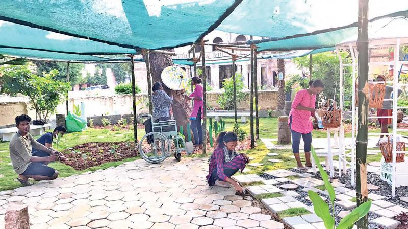 Students of Sathyabama College working on the project to create a park at CSI school for the deaf. (Photo: DC)