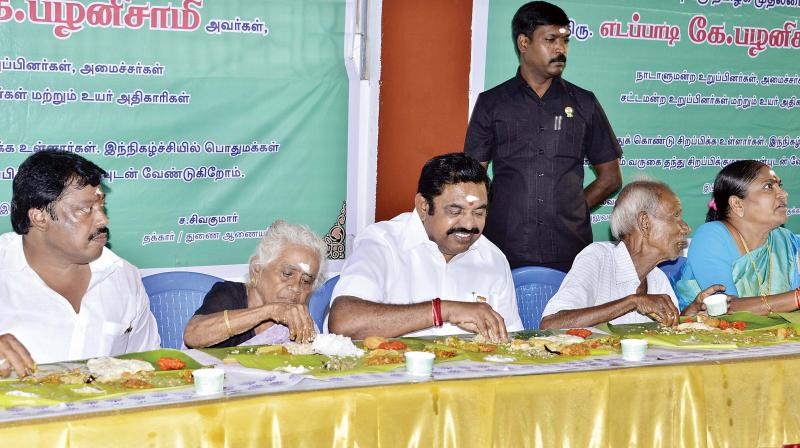 CM Edappadi K. Palaniswami takes part in a Samapandhi Bhojanam at a K.K. Nagar temple.