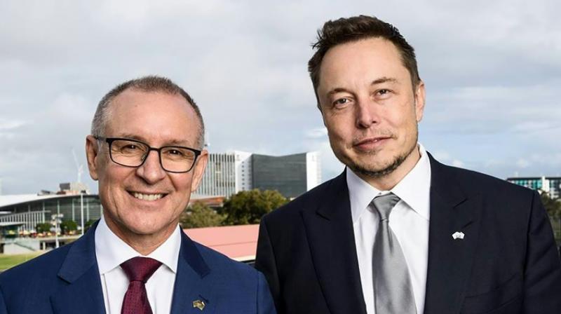 A handout photo taken and received on July 7, 2017, shows South Australias Premier Jay Weatherill (L) and Tesla Motors CEO Elon Musk (R) at an announcement in Adelaide.