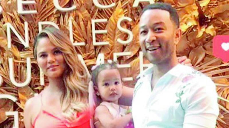 Chrissy Teigen shines with hubby John Legend and daughter Luna