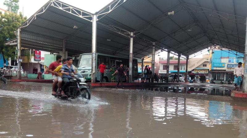 A flooded Ambattur industrial estate bus depot even during brief spells of rain. (Photo: DC)