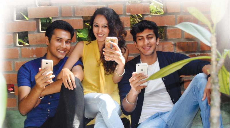 A picture of youngsters using their phones used for representational purposes only.