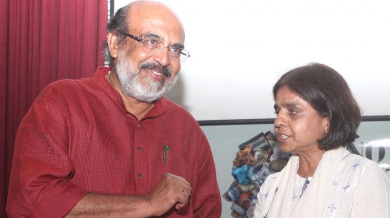 Finance minister Dr. T. M. Thomas Issac interacts with Sunita Narain, director-general, Centre for Science and Environment, during the launch of the book Not In Your Backyard, she co-authored in Thiruvananthapuram on Thursday. 	ON ARRANGEMENT