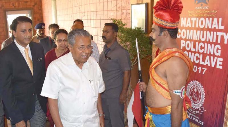 A policeman in erstwhile Royal Police bodyguards uniform welcomES Chief Minister Pinarayi Vijayan at the National Community Policing Conclave 2017, in Thiruvanant-hapuram on Thursday. (Photo: DC)