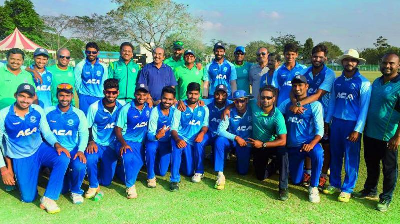 A jubilant Andhra cricket team pose after defeating Mumbai to win their sixth straight league match in Group C at the Vijay Hazare one-day cricket tournament on Wednesday.