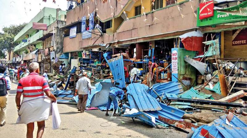 Corporation staff remove encroachments on Station Road in West Mambalam. (Photo: DC)