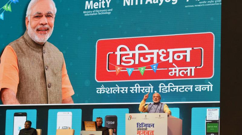 Prime Minister Narendra Modi addressing at the launch of a new mobile app BHIM to encourage e-transactions during the Digital Mela at Talkatora Stadium in New Delhi. (Photo: PTI)