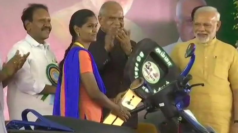 Prime Minister Narendra Modi launches subsidized Scooty scheme for working women on the occasion of late Tamil Nadu CM J Jayalalithaas birth anniversary in Chennai. (Photo: ANI/Twitter)