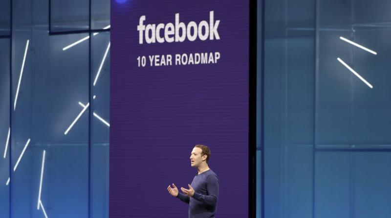 Facebook CEO Mark Zuckerberg makes the keynote speech at F8, Facebooks developer conference in San Jose, Calif. Facebook Inc. reports earnings Tuesday, Oct. 30. (AP Photo/Marcio Jose Sanchez, File)