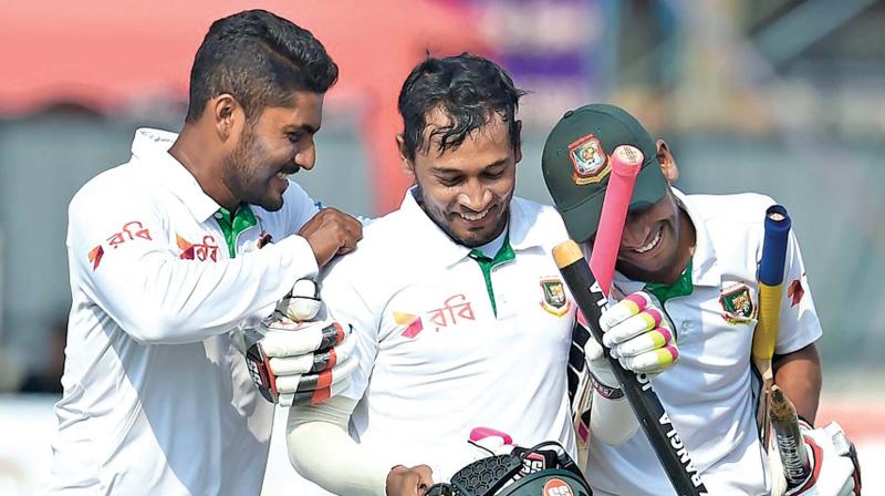 Imrul Kayes, Mushfiqur Rahim and Mehedi Hasan bask in glory after the victory over Sri Lanka. (Photo: AFP)