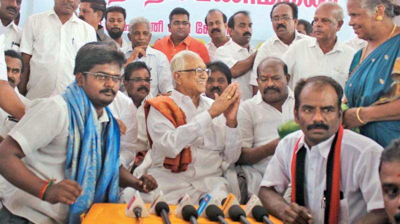 DMK general secretary K. Anbazhagan interacts with media persons after  inaugurating the partys election office at R. K. Nagar Assembly constituency on Sunday. Party candidate N. Marudhuganesh is also seen. (Photo: DC)