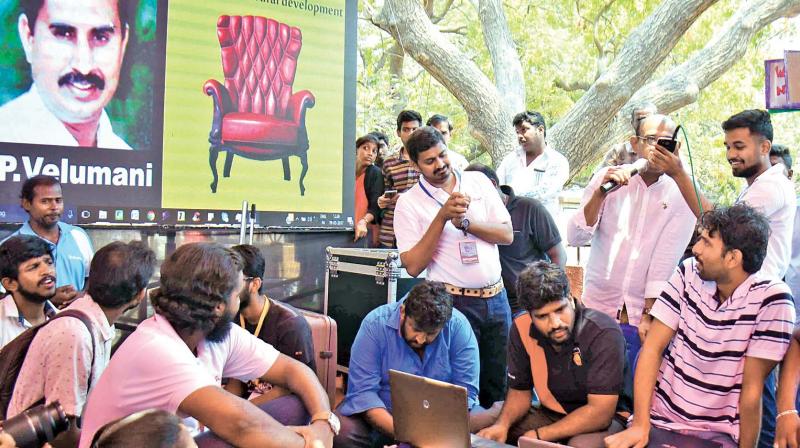 Members of the public try to converse with legislators over phone during the first-of-its-kind Coffee With MLAs event held under the aegis of a NGO  Arappor Iyakkam, at the citys landmark Valluvar Kottam, on Sunday.  None of the MLAs turned up (Photo: E. K. Sanjay)