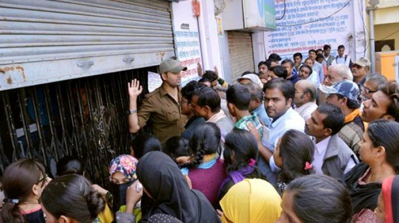 The victim had been standing in the queue before the Canara Bank branch near Burz wala Kuan, the SP said, adding that police has been deployed in view of huge crowds collecting in front of banks. (Photo: PTI)