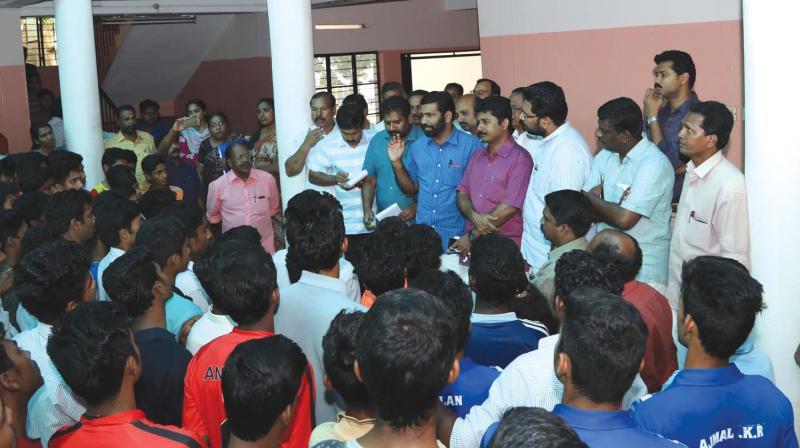 Assembly committee chairman T.V. Rajesh, MLA and other members interact with the students of GV Raja Sports School, on Sunday. (Photo: DC)