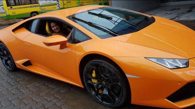 Narendra Mehtas wife in his Lamborghini (Photo: Facebook)