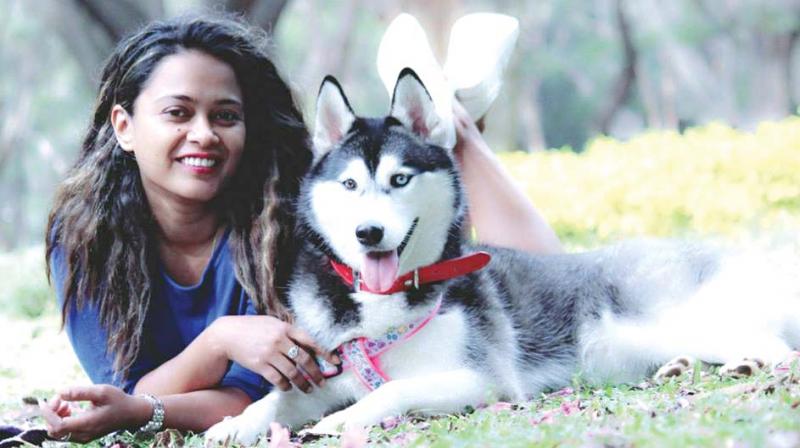 Lopa, a young Bengalurean with a pet. The dog trainer has adopted strays.