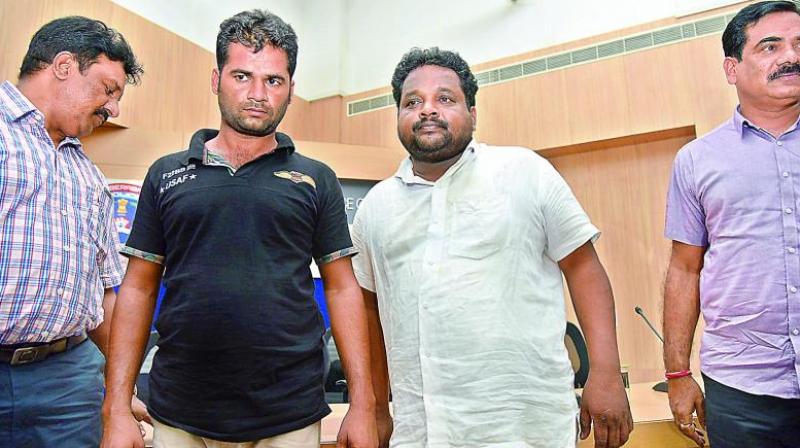 The killers of Amboji Naresh  Swathis father T. Srinivas Reddy (right) and his nephew Nalla Sathi Reddy (middle)  after their arrest. (Photo: DC)