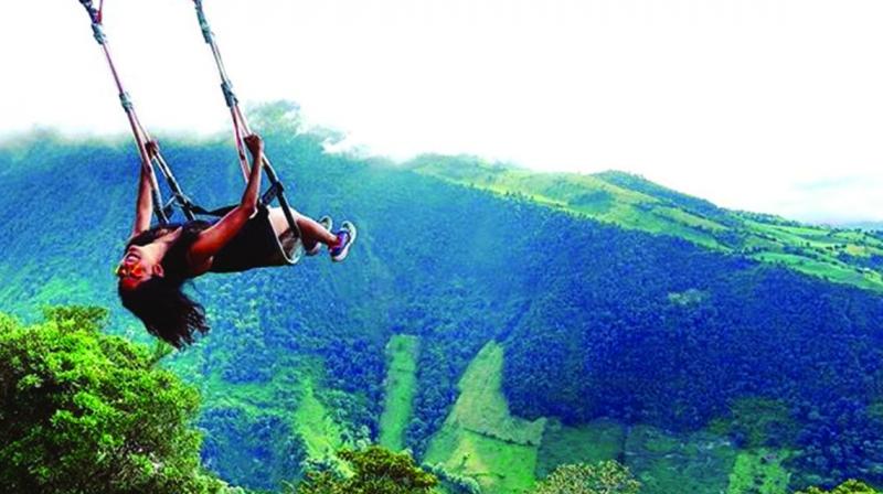 Swing at the end of the world in Ba±os, Ecuador.