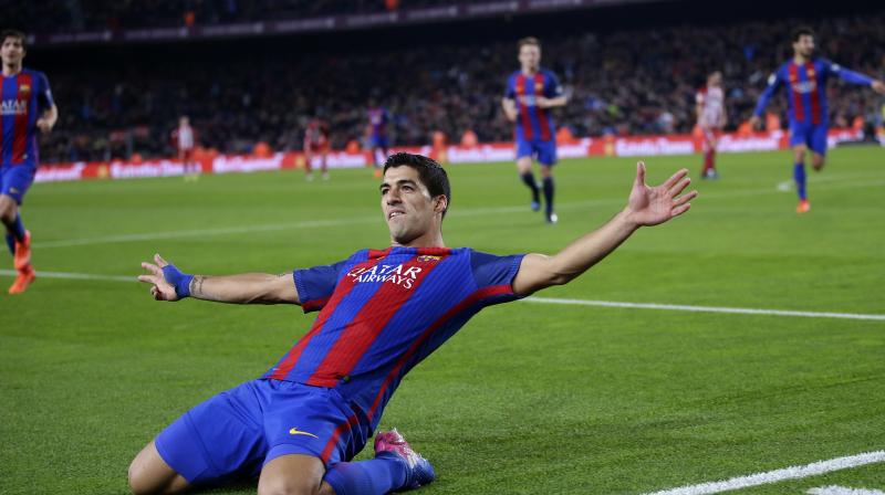 Luis Suarez, whose second goal of the tie looked to have put the semifinal beyond the visitors just before half-time, also received his first red card for the club and will miss the Copa del Rey final. (Photo: AP)