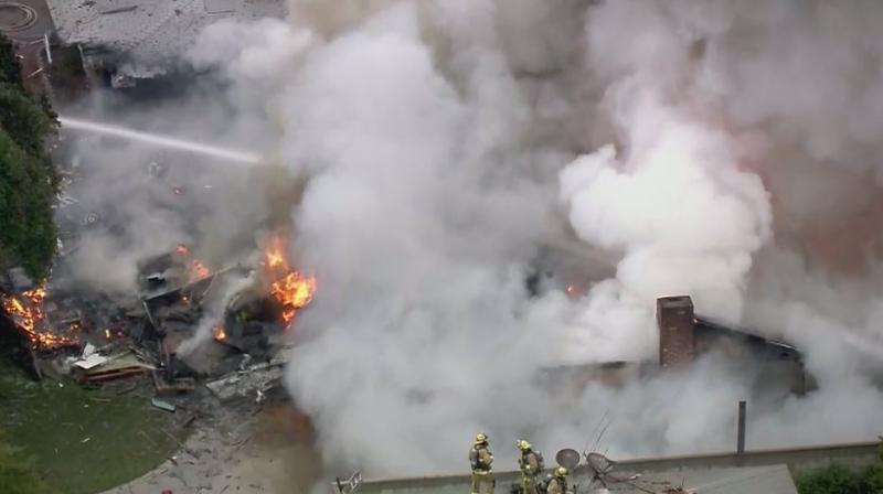 Images broadcast by KABC-TV from the scene showed firefighters covering, what appeared to be, a body with a tarp and pouring water on the home in Riverside, about 60 miles (100 kilometres) east of Los Angeles. (Photo: Twitter)