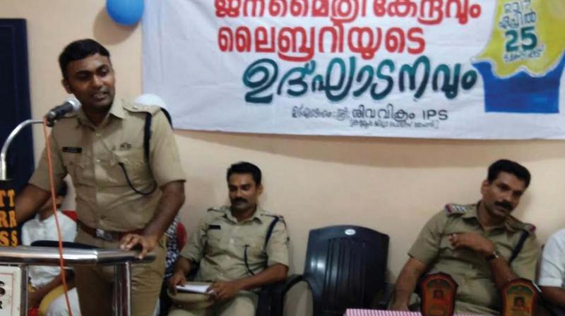 Kannur district police chief G. Siva Vikram speaks at the inauguration of the library-cum-reading room at Panoor police station on Tuesday.