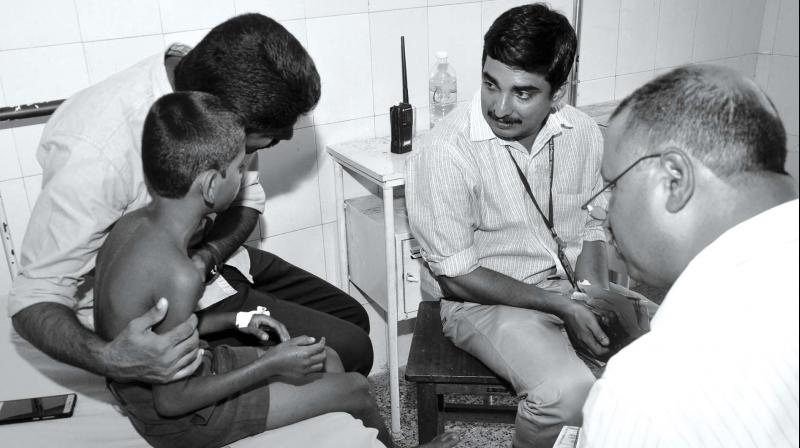 Child Welfare Committee officials visit the child at the hospital.  BY ARRANGEMENT