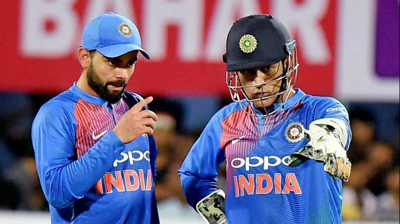 Former India skipper MS Dhoni was caught on stump mic advising, encouraging and lauding Kedar Jadhav, current Team India captain Virat Kohli, Dinesk Karthik and co during the second ODI versus New Zealand in Pune. (Photo: PTI)