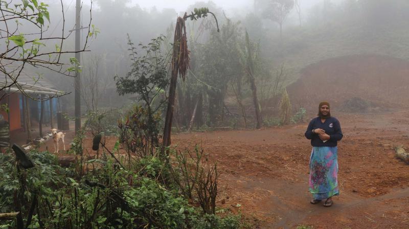 Braving tough times: Janaki of Mutlu village stands in front of her house (Pics: Vinay Madhav)