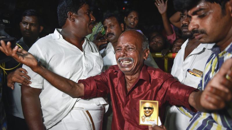 Dravida Munnetra Kazhagam (DMK) party cadres react after Kauvery Hospital released a bulletin on party president M Karunanidhis health in the evening, in Chennai, on Monday. (Photo: PTI)