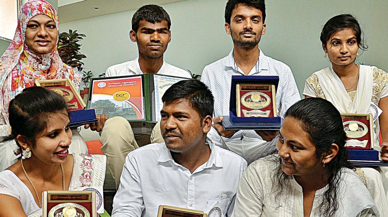 Students who were honoured with medals at the BU convocation on Friday. (Photo: DC)
