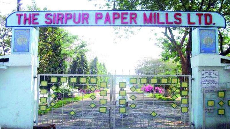 The locked gates of the troubled paper mill.