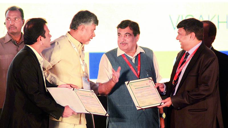 Representatives of CRDA and NHAI signed MoUs in the presence of Chief Minister N. Chandrababu Naidu and Union minister Nitin Gadkari during the CII Partnership Summit in Visakhapatnam on Saturday. (Photo: DC)