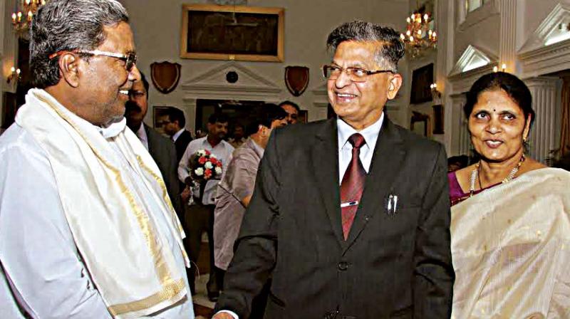 CM Siddaramaiah greets Lokayukta P.Vishwanatha Shetty. (Photo: R. Samuel)