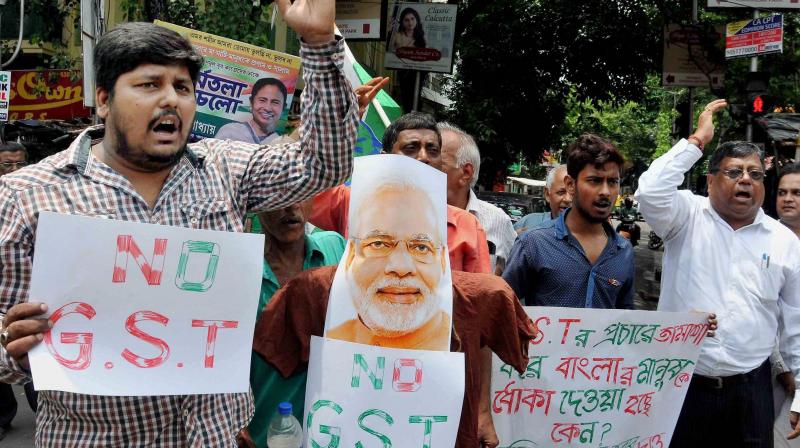 Congress party activists protest against GST roll out in Kolkata on Saturday. (Photo: PTI)