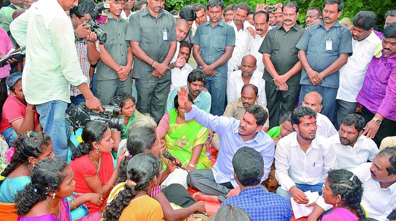 YSRC chief and Opposition Leader Y.S. Jagan Mohan Reddy interacts with patients of Chaparai village, at the area hospital in Rampachodavaram on Saturday. (Photo: DC)