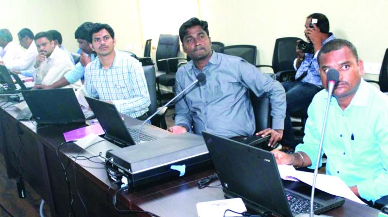Fingerprint experts from across Telangana state undergo training in new technology that is being introduced by the police department under the super vision of Russian experts, at CCS in Hyderabad on Saturday. (Photo: DC)