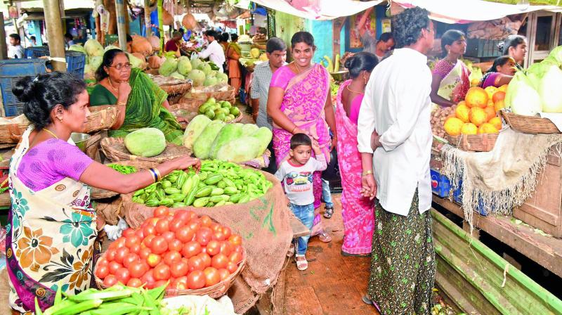 Vegetable vendors at Poorna Market in Visakhapatnam on Saturday. (Photo: DC)