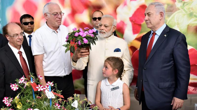 Prime Minister, Narendra Modi with his Israeli counterpart Benjamin Netanyahu,visiting the Danziger Flower Farm- a leading facility for R&D in plant varieties, in Tel Aviv, Israel. (Photo: PTI)