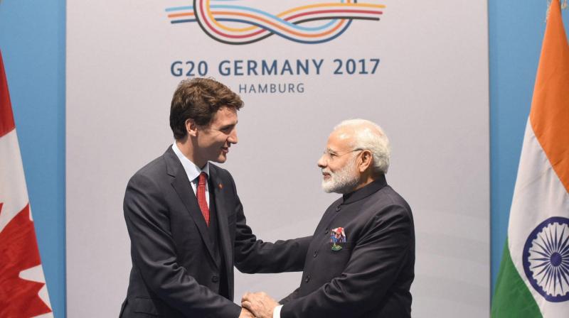 Prime Minister Narendra Modi meeting the Prime Minister of Canada, Justin Trudeau, on the sidelines of the 12th G-20 Summit, at Hamburg, Germany. (Photo: AP)