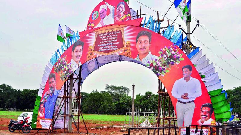 Arrangements in progress for YSRC Plenary meeting in front of Acharya Nagarjuna University in Guntur district on Friday. (Photo: DC)