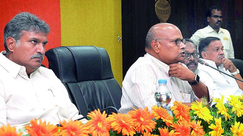 Minister Yanamala Ramakrishnudu and MP Kesineni Srinivas at the review meeting held at the irrigation camp office in Vijayawada on Monday.