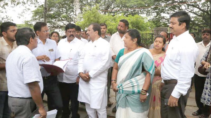 Bengaluru development minister K.J. George and Mayor Padmavathi review development works in Bengaluru on Tuesday. (Photo: DC)